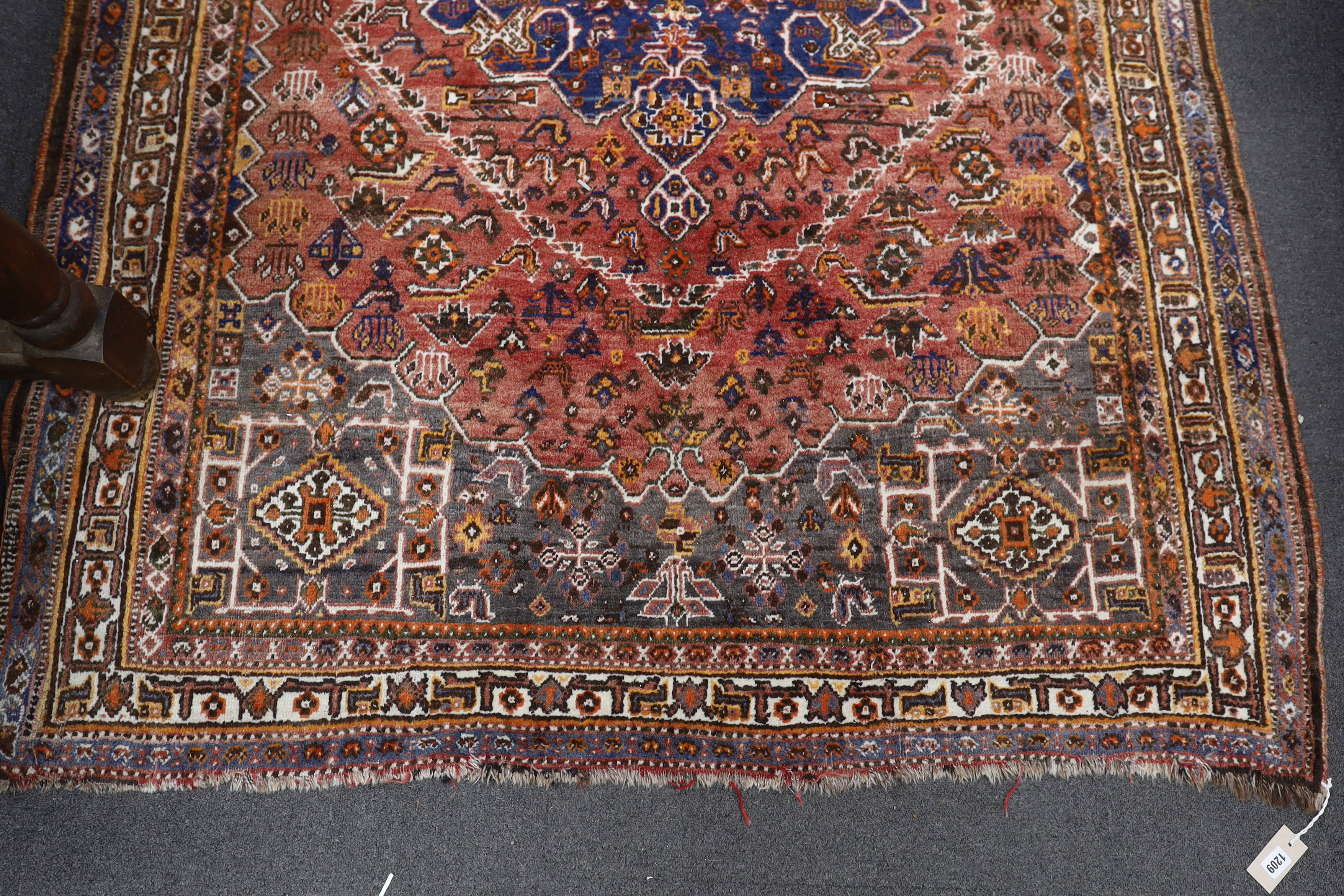 A North West Persian red ground rug, 214 x 156cm